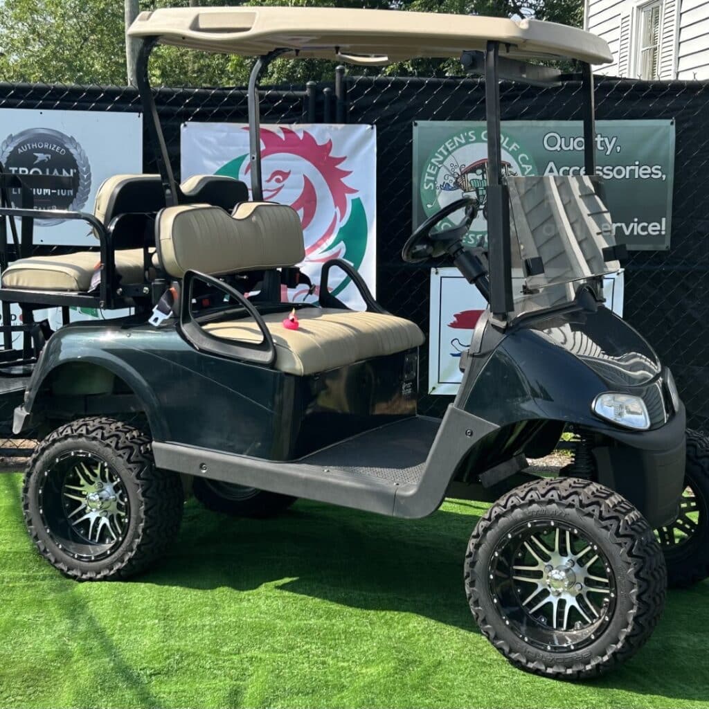 Black 4-passenger golf cart with custom wheels and upgraded suspension for sale at Golf Carts Atlanta.