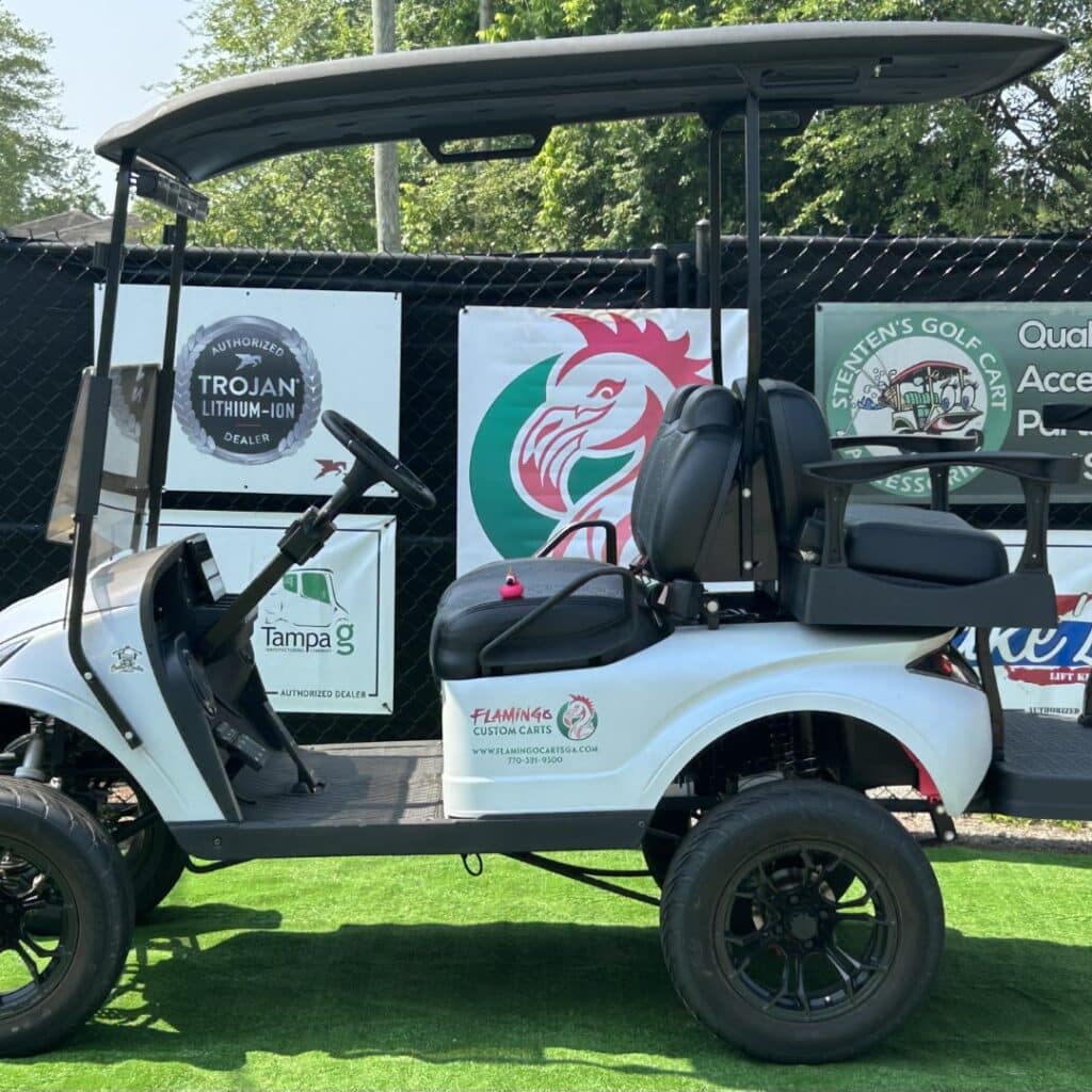 White custom golf cart with accessories and branding, available at Golf Carts Atlanta.