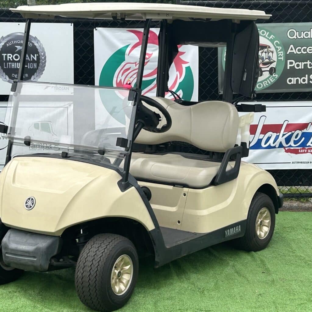 Refreshed Yamaha golf cart with new lead acid batteries and gold wheels.